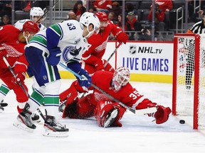 Vancouver Canucks centre Bo Horvat (53) scores on Detroit Red Wings goaltender Jimmy Howard (35) during the third period of an NHL hockey game Tuesday, Oct. 22, 2019, in Detroit.  ORG XMIT: MIPS112 [PNG Merlin Archive]