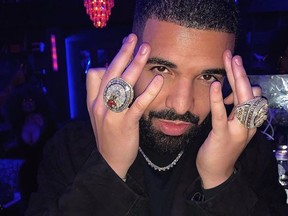 Drake showcases the Raptors championship ring, alongside his own extravagant custom-made ring at a party for his 33rd birthday.