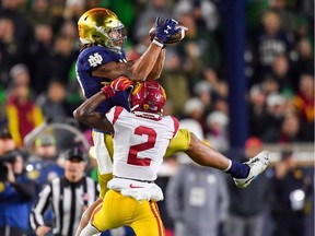 Notre Dame Fighting Irish wide-receiver Chase Claypool catches a pass as USC Trojans cornerback Olaijah Griffin defends at Notre Dame Stadium on Oct. 12.