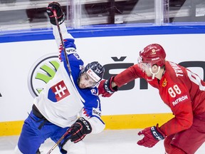 Tomas Jurco of Slovakia gets hassled by Nikita Tryamkin of Russia during the group A match Russia vs Slovakia of the 2018 IIHF Ice Hockey World Championship in Denmark.