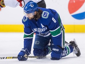 Vancouver defenceman Chris Tanev kneels on the ice after blocking a shot during a game against the New Jersey Devils in Vancouver on March 15, 2019. Tanev was forced to leave the game, an all-too-common refrain in his recent tenure with the Canucks.