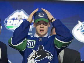 Vancouver Canucks select Vasili Podkolzin during the first round NHL draft at Rogers Arena in Vancouver, Friday, June, 21, 2019.
