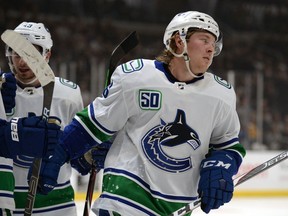 Brock Boeser sustained an injury Saturday after getting tangled up with Calgary Flames forward Andrew Mangiapane.