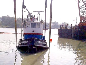 The 19-metre-long George H. Ledcor went down while hauling a loaded gravel barge on the north arm of the Fraser River.