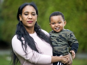 Mubarak Ockbey and her son, Adam Teklemicael, 20 months old, outside their Burnaby home on Nov. 7.