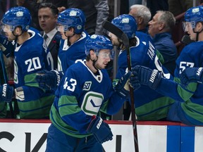 Vancouver Canucks blueliner Quinn Hughes does the post goal-scoring skate past his team's bench during the Canucks' game against the St. Louis Blues at Rogers Arena on Nov. 5, 2019.