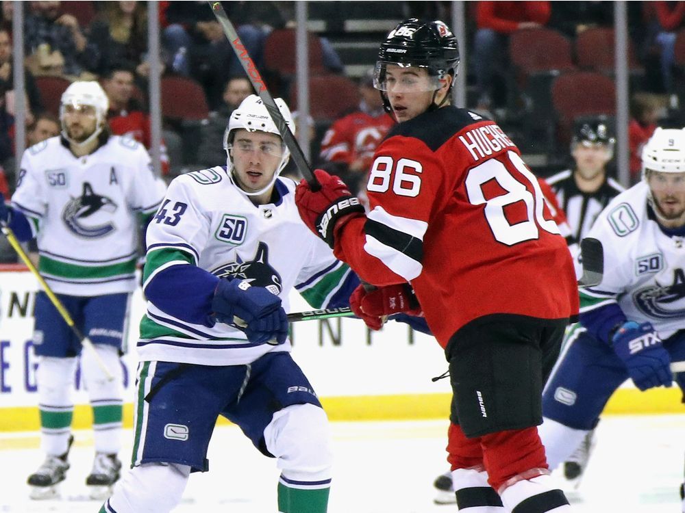 Hughes bests older brother as Devils rout Canucks 7-2 - The San Diego  Union-Tribune