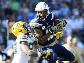 Keenan Allen of the Los Angeles Chargers makes a reception against Jaire Alexander of the Green Bay Packers during Sunday's game at Dignity Health Sports Park in Carson, Calif.