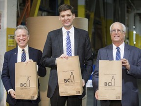 The bags are study enough to carry six bottles of wine or one six-pack of beer and two bottles of wine. Metro Vancouver stores will see the paper bags beginning in February. George Heyman Minister of Environment (left), Attorney General David Eby, and Malcolm Brodie mayor of Richmond.
