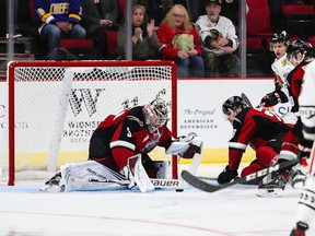 Trent Miner covers up the puck against the Portland Winterhawks in the Vancouver Giants' 2-1 shootout loss on the road Saturday night.