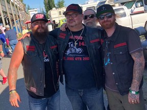 Throttle Locker Zale Coty, centre, poses with his biker mates.
