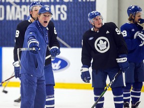 Toronto Maple Leafs head coach Mike Babcock shouts instructions during practice at the Ford Performance Centre in Toronto on Thursday October 24, 2019. (Ernest Doroszuk/Toronto Sun)