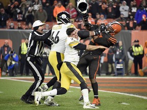 Quarterback Mason Rudolph of the Pittsburgh Steelers fights with defensive end Myles Garrett of the Cleveland Browns at FirstEnergy Stadium on November 14, 2019 in Cleveland. (Jason Miller/Getty Images)