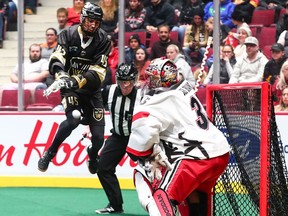 Calgary Roughnecks at Vancouver Warriors. Keegan Bal shoots against netminder Christian Del Bianco.