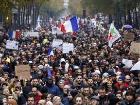 Protestors march as they protest against islamophobia, in Paris, Sunday, Nov. 10, 2019.