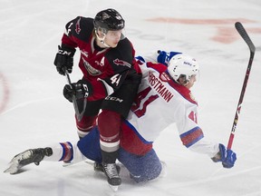 Vancouver Giants defenceman Bowen Byram (left) in action against Tyler Horstmann and the Edmonton Oil Kings during a Nov. 23, 2019 WHL game at the Langley Events Centre.