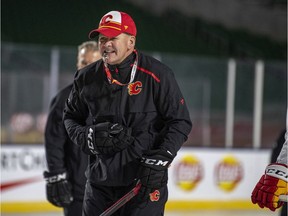 Calgary Flames head coach Bill Peters looks on during practice for the NHL Heritage Classic outdoor hockey game in Regina on Friday, October 25, 2019.