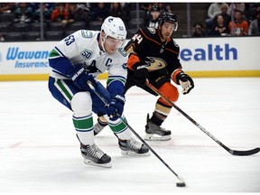 Vancouver Canucks centre Bo Horvat moves the puck against Anaheim Ducks defenceman Michael Del Zotto during the first period at Honda Center.