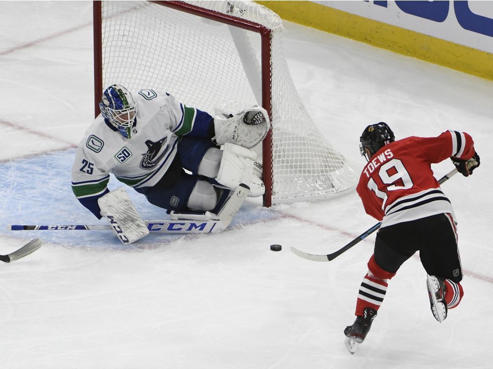 Canucks lose the game and Tanev in the Windy City