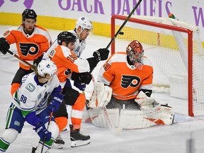 Philadelphia Flyers goaltender Carter Hart makes a save against the Vancouver Canucks during the third period at Wells Fargo Center.