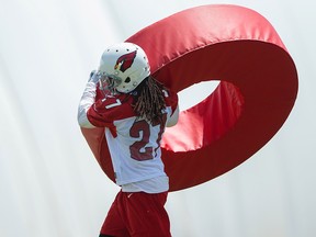 Arizona Cardinals defensive back Josh Shaw (27) does tackling drills with a roll tackle ring during minicamp at the teams Tempe training facility. (Mark J. Rebilas-USA TODAY Sports/File Photo)