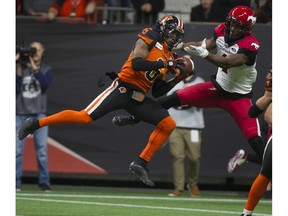 BC Lions  T.J. Lee intercepts a pass intended for Calgary Stampeders Hergy Mayala at BC Place Nov. 2.