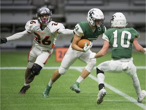 Tweedsmuir Panthers' Rhys Huston outruns a tackle by New Westminster Hyacks defender Tyson Black Saturday in the Subway Bowl quarter-finals at B.C. Place Stadium.