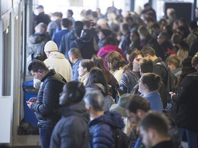 Transit riders prepare to board a sea bus to North Vancouver from the Waterfront station terminal, Vancouver, November 01 2019.