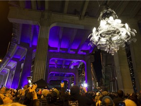 The Spinning Chandelier by Rodney Graham is officially unveiled under the Granville St. Bridge.