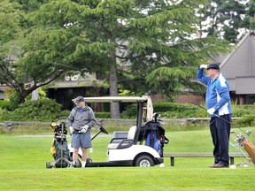 Golfers on the tee of the first hole at Langara Golf Course.