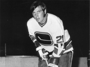 Barry Wilkins in the Vancouver Canucks' inaugural season of 1970-71, wearing an unfamiliar No. 21 jersey for this portrait — the blueliner actually wore No. 4, at least partly in honour of his junior hockey teammate — and more familiar No. 4 — Bobby Orr.