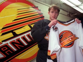 Former Vancouver Canucks star Pavel Bure, a.k.a. The Russian Rocket, holds his infamous skate jersey in 1992.