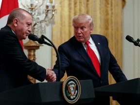 U.S. President Donald Trump and Turkish President Tayyip Erdogan shake hands during a joint news conference at the White House in Washington, November 13, 2019.