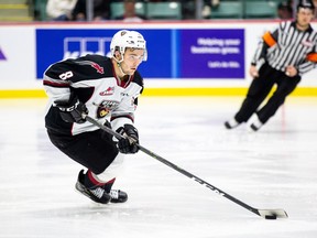 Vancouver Giants centre Tristen Nielsen moves the puck up ice during a WHL game.