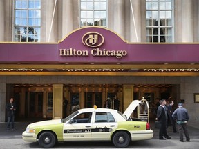 A taxi, which is part of a movie set, sits in front of the Hilton Hotel on Michigan Avenue on September 12, 2013 in Chicago, Illinois.