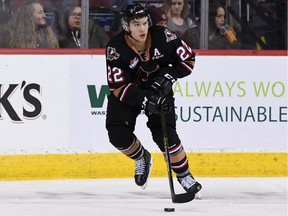 Vancouver Canucks prospect Jett Woo in action this season with the WHL's Calgary Hitmen.