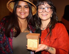 Malia Terry and Lattimer Gallery’s Emma DelliCarpini displayed one of the beautiful Bentwood Boxes that went on the charity auction block. Photo: Fred Lee.