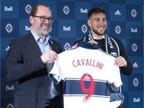 Vancouver Whitecaps sporting director Axel Schuster welcomes the team's newest signing, Canadian striker Lucas Cavallini, at a 2019 press conference. The biggest signing in Whitecaps history came a month after Schuster was hired as sporting director.