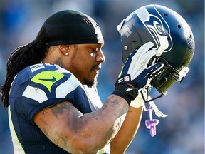 Marshawn Lynch looks on during the third quarter of the NFC Divisional Playoff Game against the Carolina Panthers at Bank of America Stadium on January 17, 2016 in Charlotte, North Carolina.