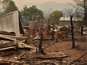 The remains of a property destroyed by fire is seen in Bobin, 350km north of Sydney on November 9, 2019, as firefighters try to contain dozens of out-of-control blazes that are raging in the state of New South Wales. - Catastrophic bushfires in eastern Australia have killed at least three people and forced thousands from their homes, with the death toll expected to rise as firefighters struggle towards hard-to-reach communities.