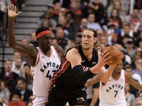 Miami Heat forward Kelly Olynyk (9) controls the ball as Toronto Raptors forward Pascal Siakam (43) defends at Scotiabank Arena.