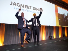Federal NDP Leader Jagmeet Singh and B.C. Premier John Horgan celebrate after Singh delivered his speech during the B.C. NDP Convention in Victoria.