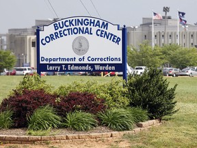 This May 3, 2011 photo shows the entrance sign to the Buckingham Correctional Center in Dillwyn, Va. (AP Photo/Steve Helber)