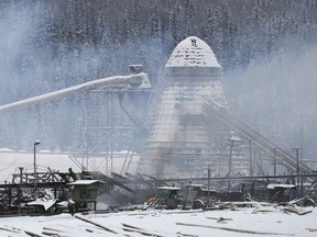 Remains of the Babine Forest Products mill smoulder shortly after the mill was destroyed by an explosion and fire in January 2012.