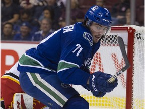 VANCOUVER. September 19 2018. Vancouver Canucks #71 Zack MacEwen looks for the puck after a save by Calgary Flames #33 David Rittich in the first period of a preseason NHL hockey game at Rogers Arena, Vancouver, September 19 2018. ( Gerry Kahrmann  /  PNG staff photo )( For Prov / Sun News )  00054680A [PNG Merlin Archive]