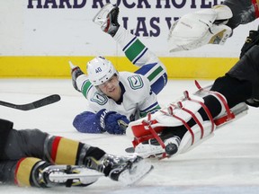 Elias Pettersson scores against Vegas Golden Knights goaltender Marc-Andre Fleury, right, during the first period.