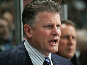 Head Coach Marc Crawford of the Vancouver Canucks speaks from the bench during their NHL game against the Chicago Blackhawks at General Motors Place on Oct. 18, 2005 in Vancouver. (Jeff Vinnick/Getty Images)