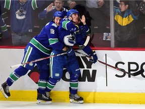 Antoine Roussel (right) celebrates his goal against the Ottawa Senators during the first period at Rogers Arena.