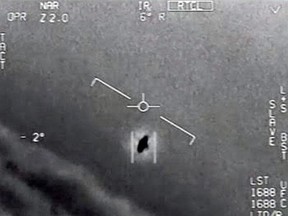 An image taken from a video released by the Defense Department's Advanced Aerospace Threat Identification Program shows a 2004 encounter near San Diego between two Navy F/A-18F fighter jets and an unknown object.