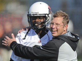 Ryan Thelwell, left, and B.C. Lions director of communications Jamie Cartmell at the Leos' practice facility in 2011.